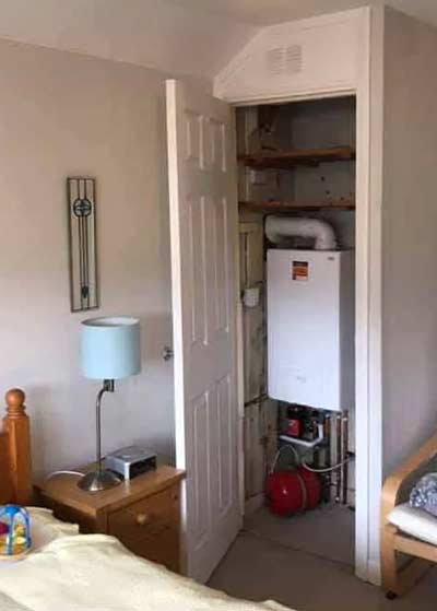 Boiler in the bedroom behind door