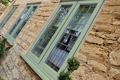 Green coloured wood effect uPVC windows