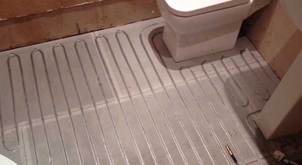 A warm floor in the bathroom with underfloor heating